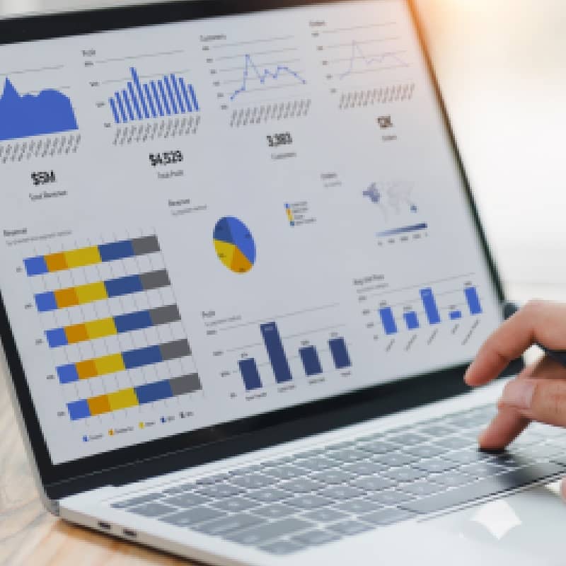 Close-up of laptop screen displaying charts and financial data